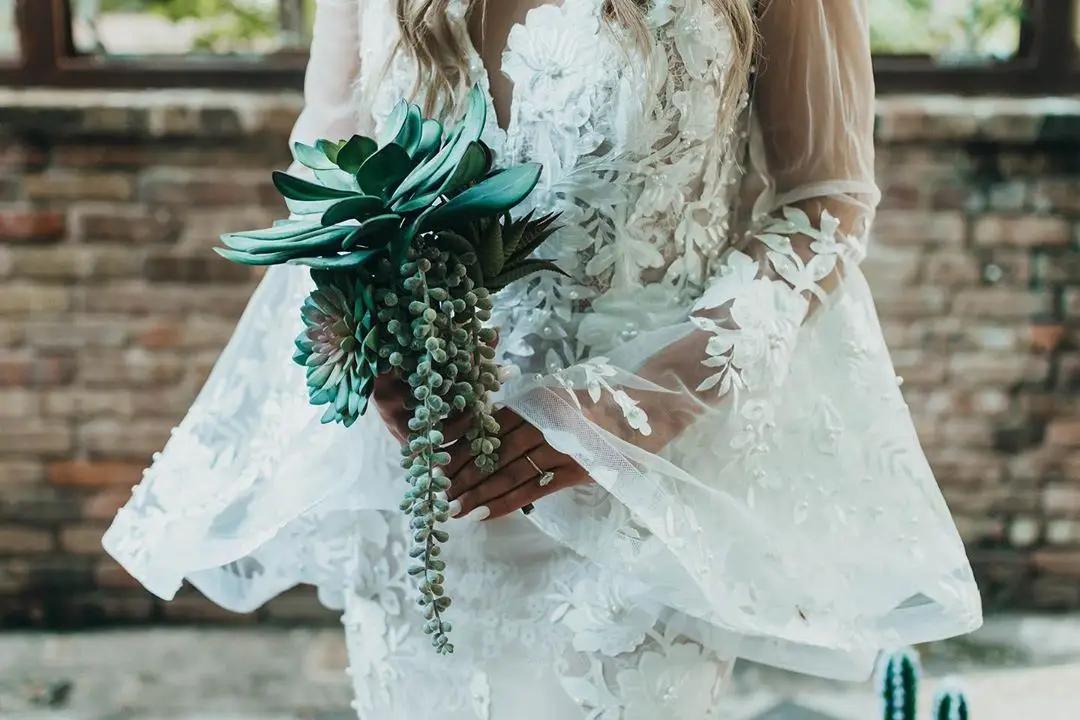 bride holding wedding flower